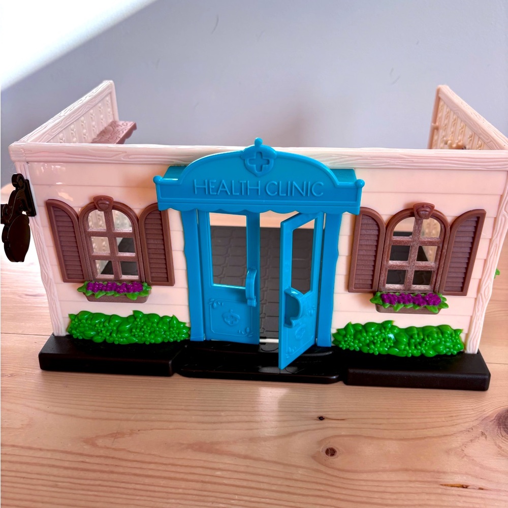 Lil woodzeez Health Clinic with Blue Door and Brown Shutters